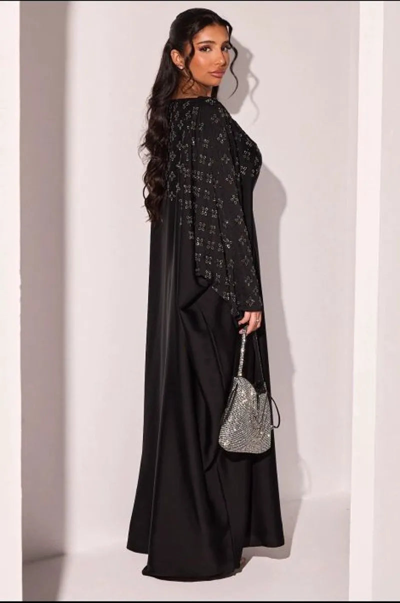 Abaya noire à strass en forme de fleurs argentées