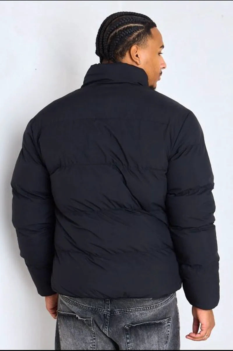 Reversible black down jacket with white shearling interior