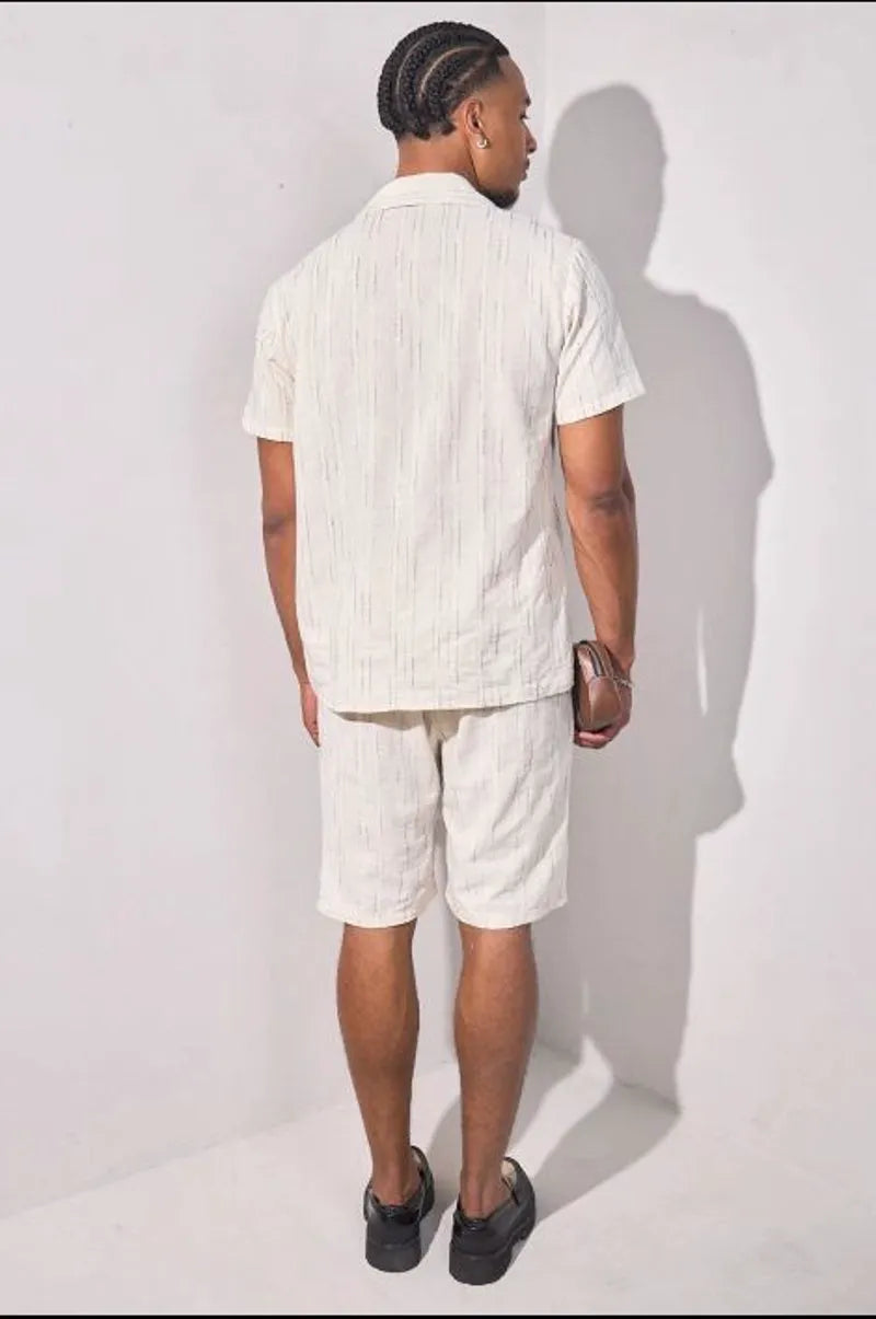 Beige two-piece set with embroidered green striped shirt and shorts