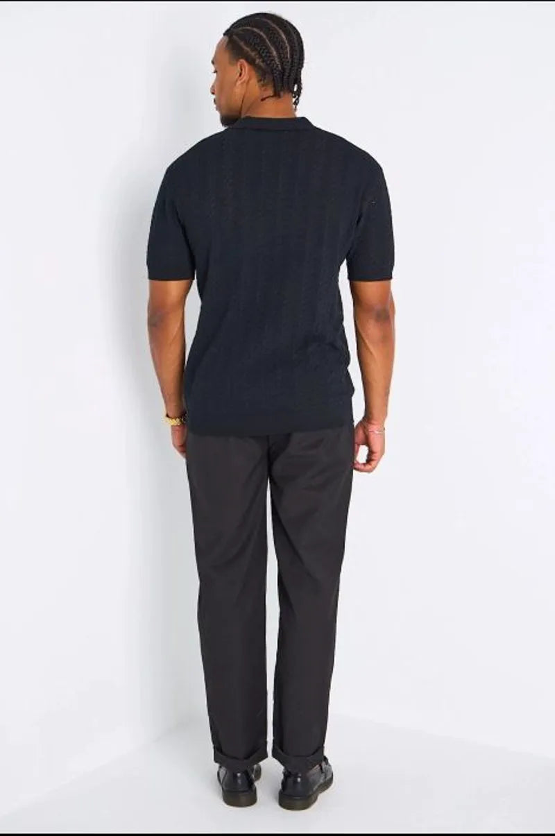 Pantalon fluide noir à coupe droite avec patte de serrage