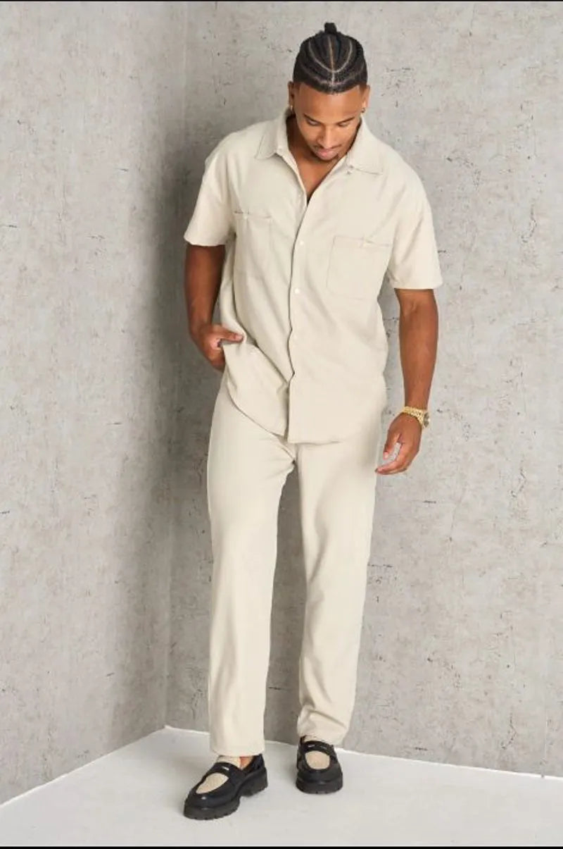 Two-piece ensemble: beige shirt and trousers