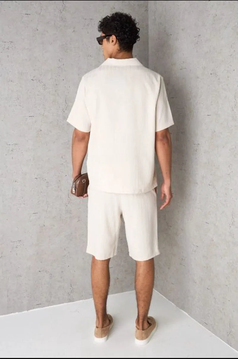 Two-piece ensemble: textured beige shirt and shorts