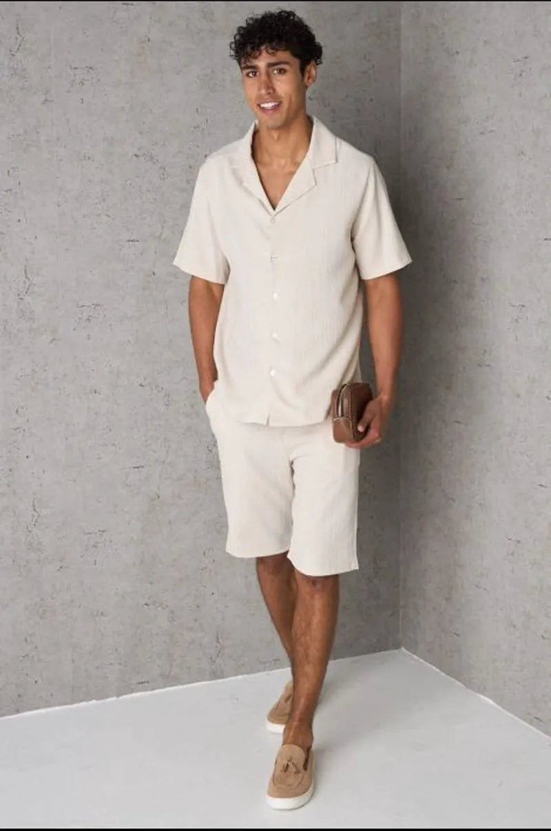 Two-piece ensemble: textured beige shirt and shorts
