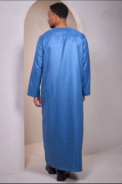 Two-piece ensemble: light blue qamis and pants with aztec pattern