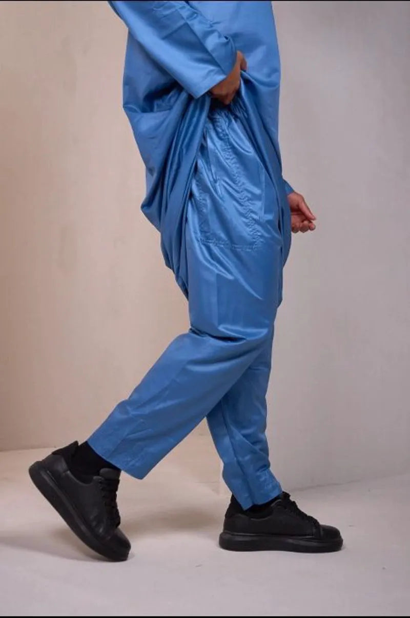 Two-piece ensemble: light blue qamis and pants with aztec pattern
