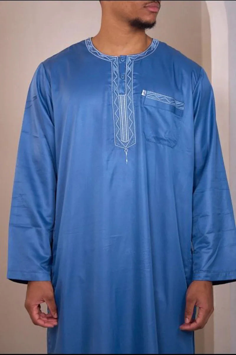 Two-piece ensemble: light blue qamis and pants with aztec pattern