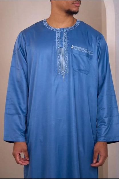 Two-piece ensemble: light blue qamis and pants with aztec pattern