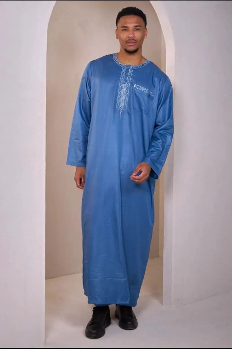 Two-piece ensemble: light blue qamis and pants with aztec pattern