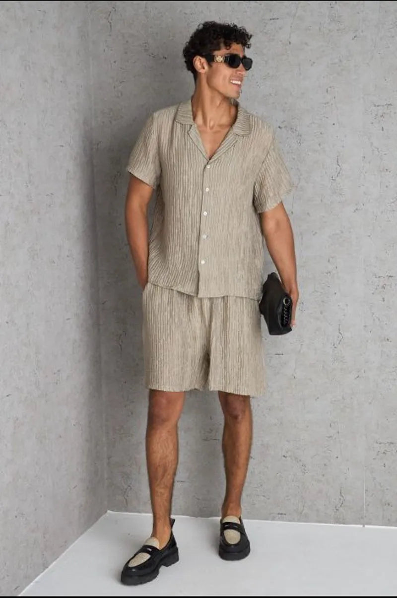 Two-piece set: pleated beige shirt and shorts