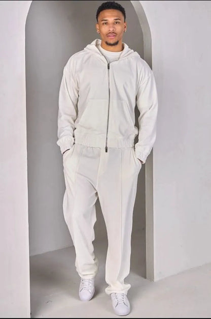 Two-piece ensemble: white velvet zip-up sweatshirt and joggers.
