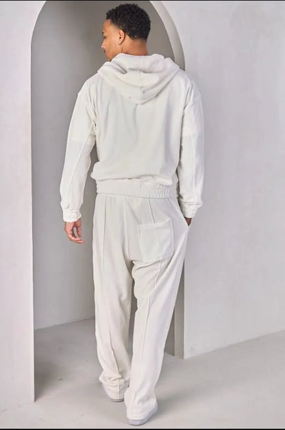 Two-piece ensemble: white velvet zip-up sweatshirt and joggers.