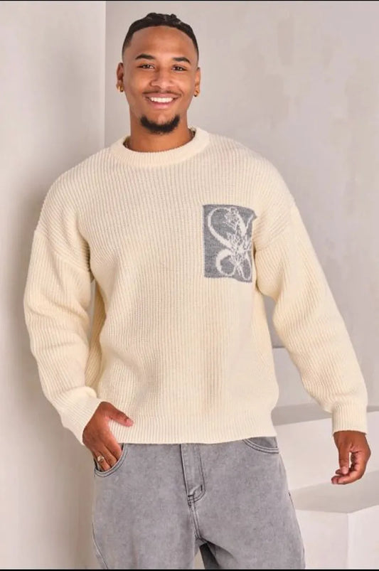 Beige knit sweater with logo on the chest and nape