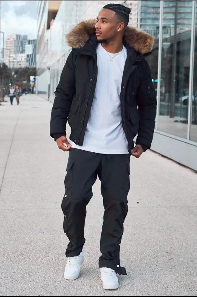 Black dual-material parka with fur-trimmed hood