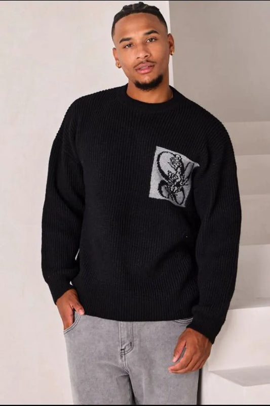 Black knit sweater with logo on the chest and nape
