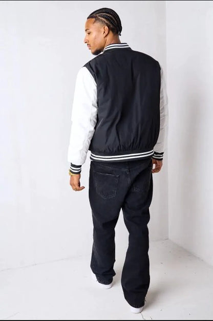 Short black and white quilted bomber jacket