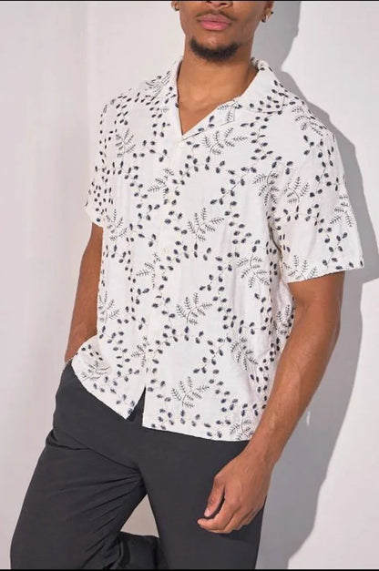 Beige linen shirt embroidered with blue leaves