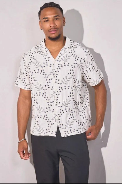 Beige linen shirt embroidered with blue leaves