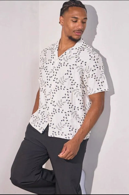 Beige linen shirt embroidered with blue leaves
