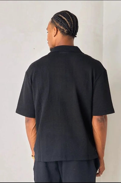 Black openwork shirt in textured fabric