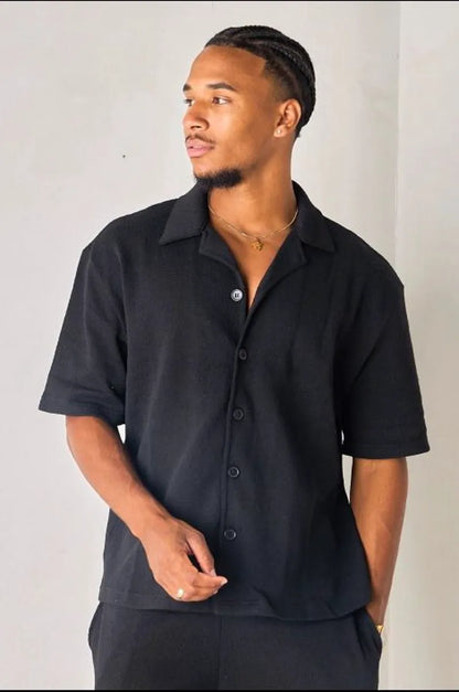 Black openwork shirt in textured fabric