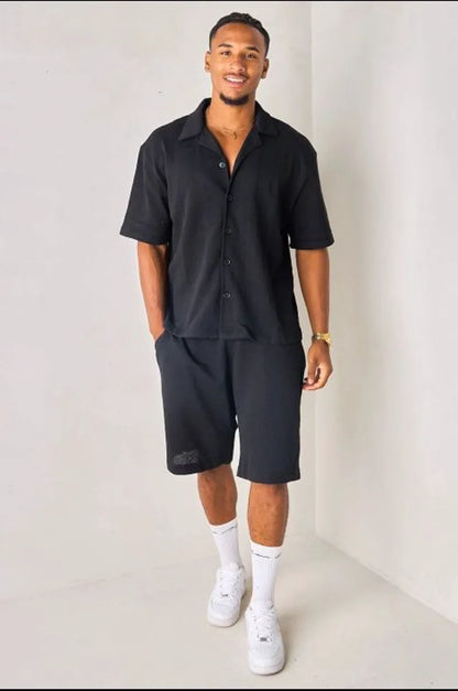 Black openwork shirt in textured fabric