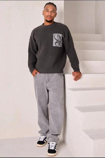 Dark gray knit sweater with logo on the chest and nape