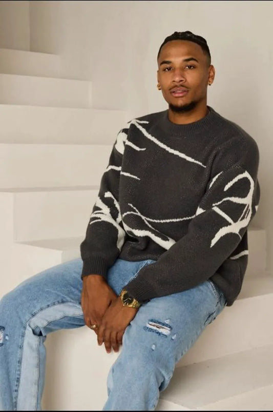 Dark gray sweater with white pattern