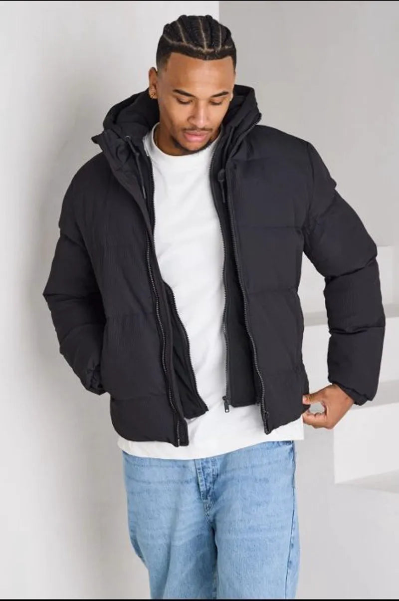 Black ribbed puffer jacket with sweatshirt panel