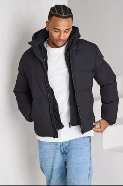 Black ribbed puffer jacket with sweatshirt panel