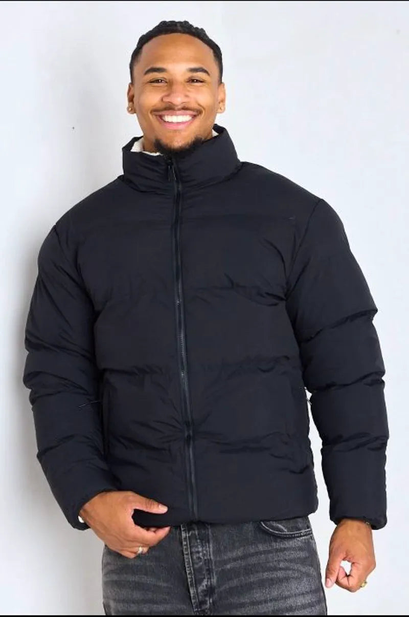 Reversible black down jacket with white shearling interior
