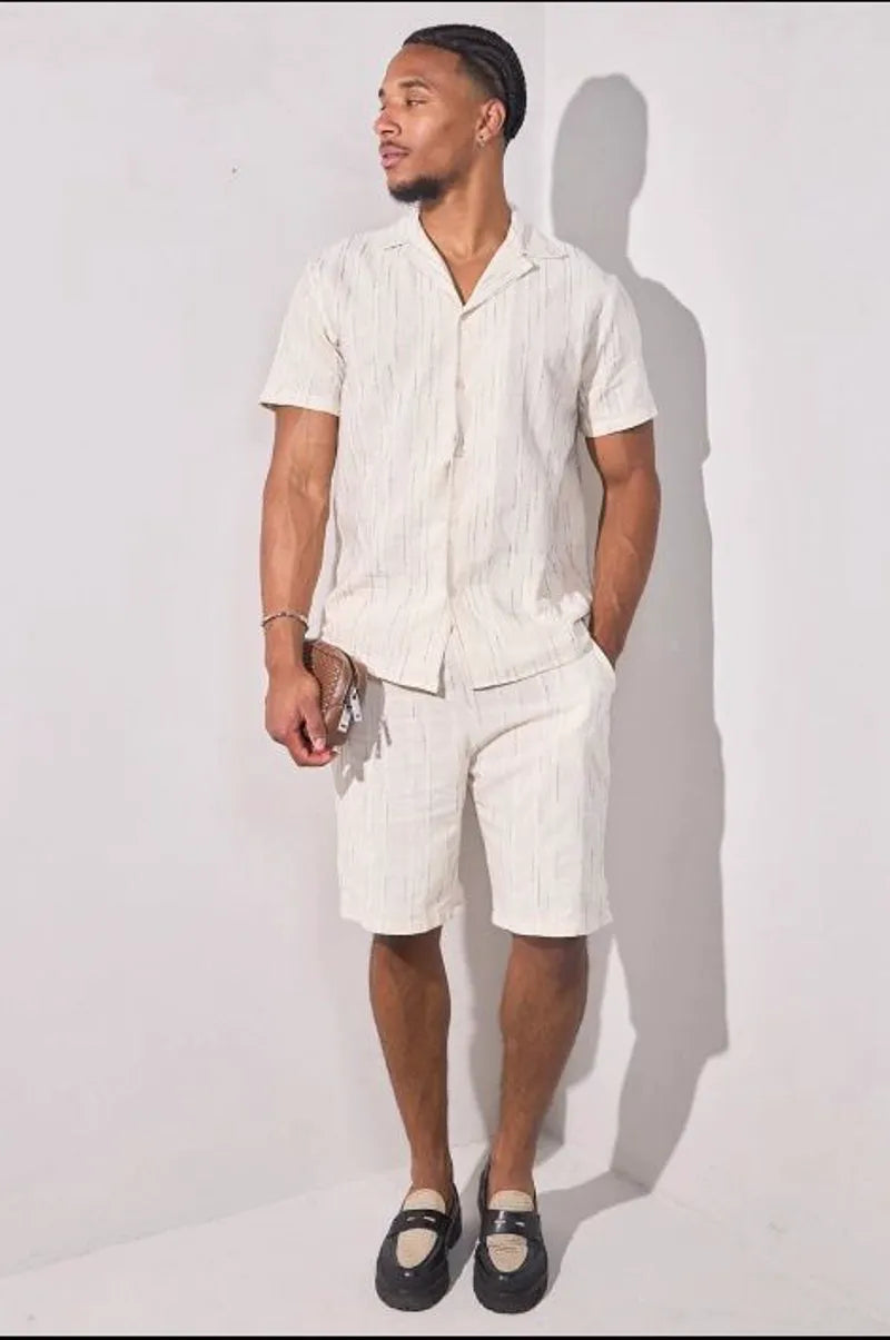 Beige two-piece set with embroidered green striped shirt and shorts