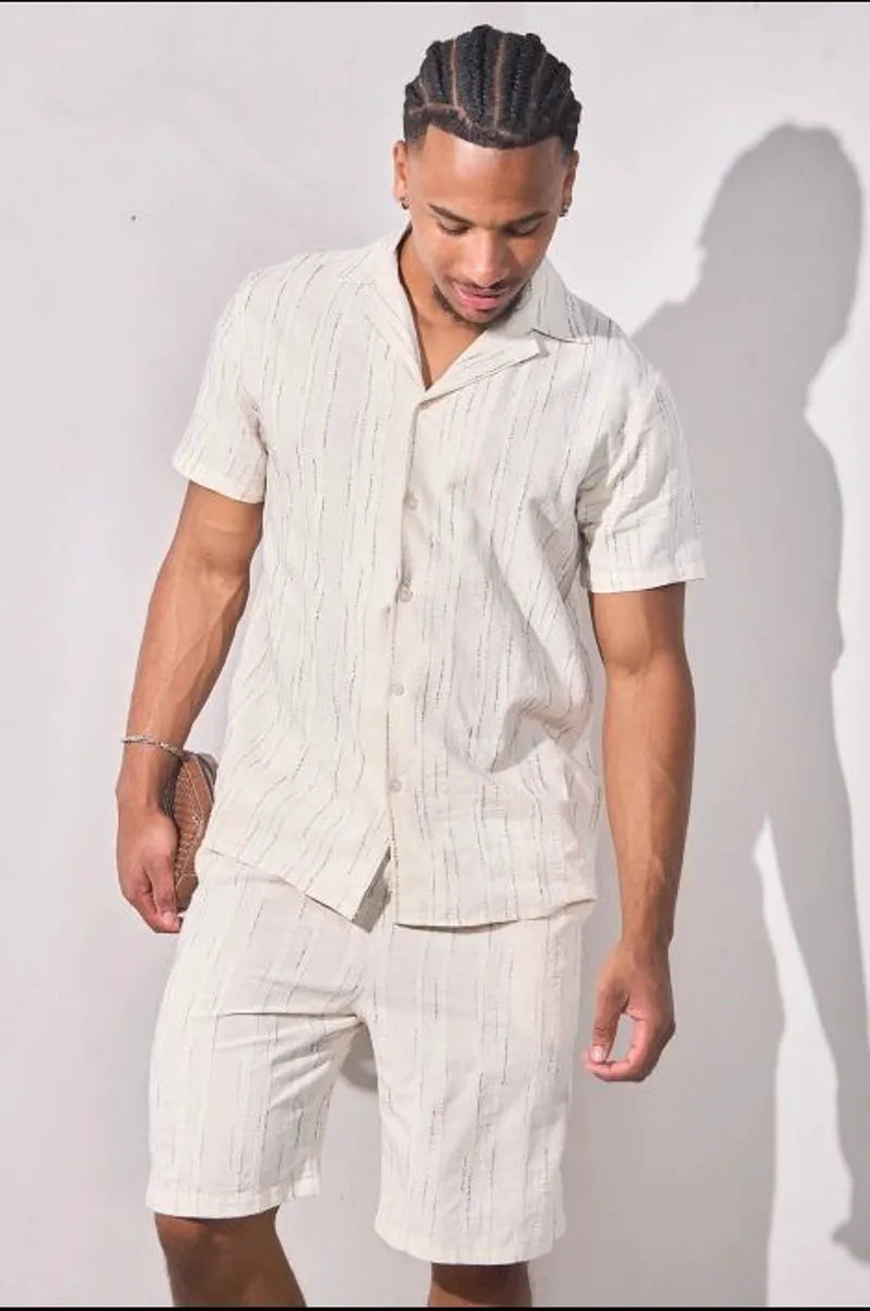 Beige two-piece set with embroidered green striped shirt and shorts