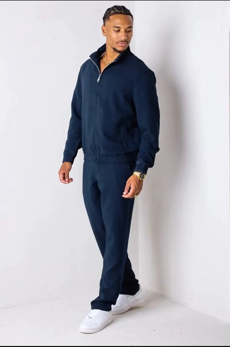 Navy blue two-piece set: zip-up jacket + trousers