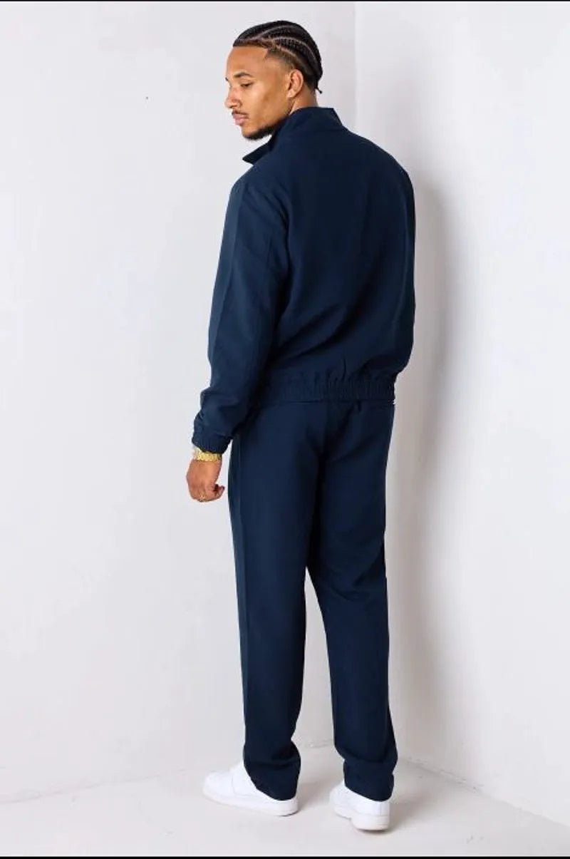 Navy blue two-piece set: zip-up jacket + trousers