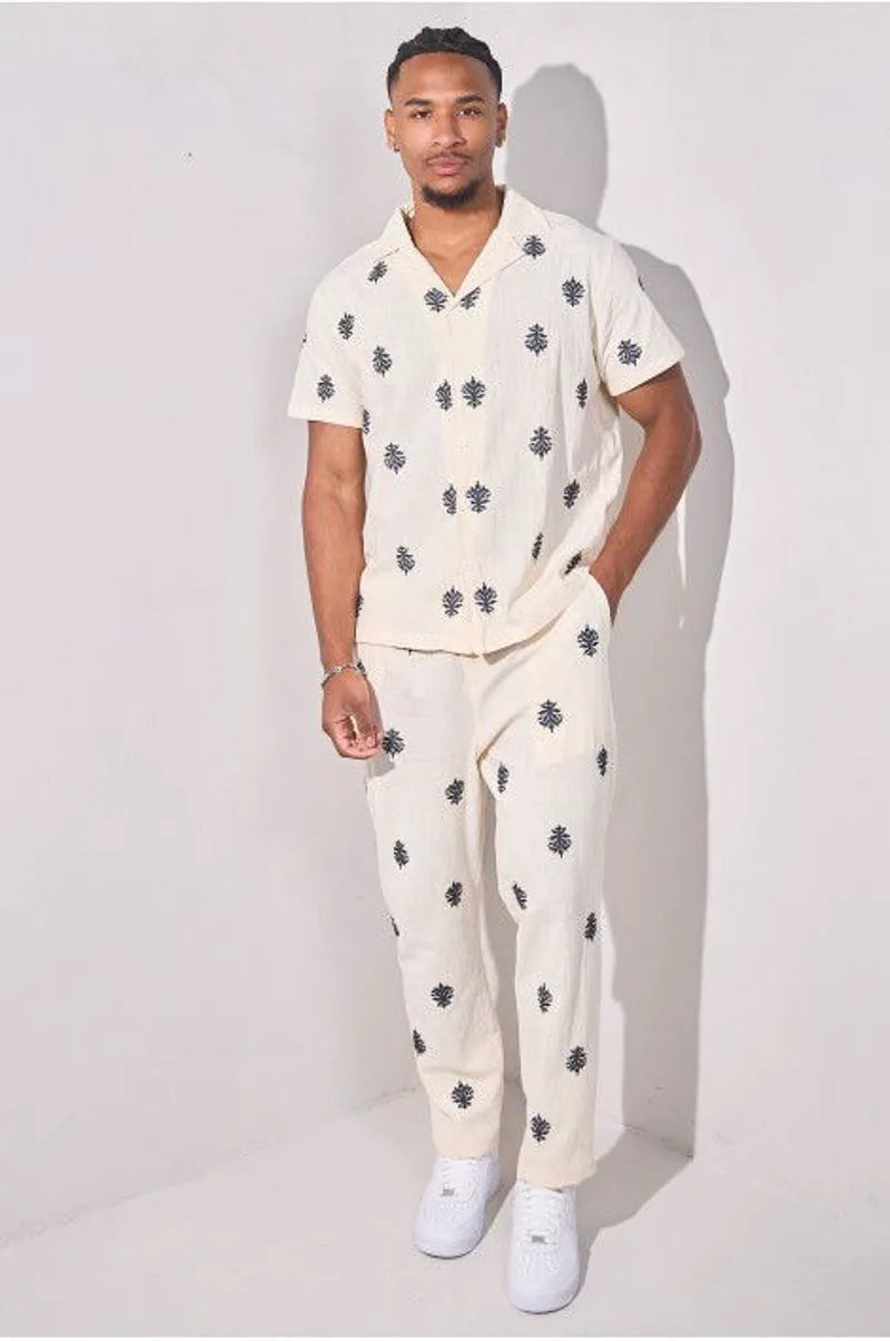 Two-piece ensemble with embroidered linen-effect shirt and beige trousers