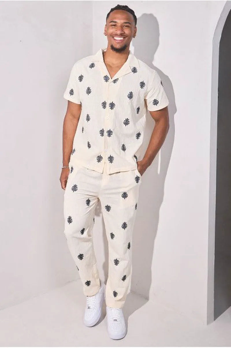 Two-piece ensemble with embroidered linen-effect shirt and beige trousers
