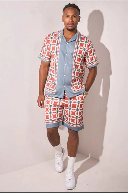 Two-piece ensemble in gray and red with geometric pattern shirt and shorts.