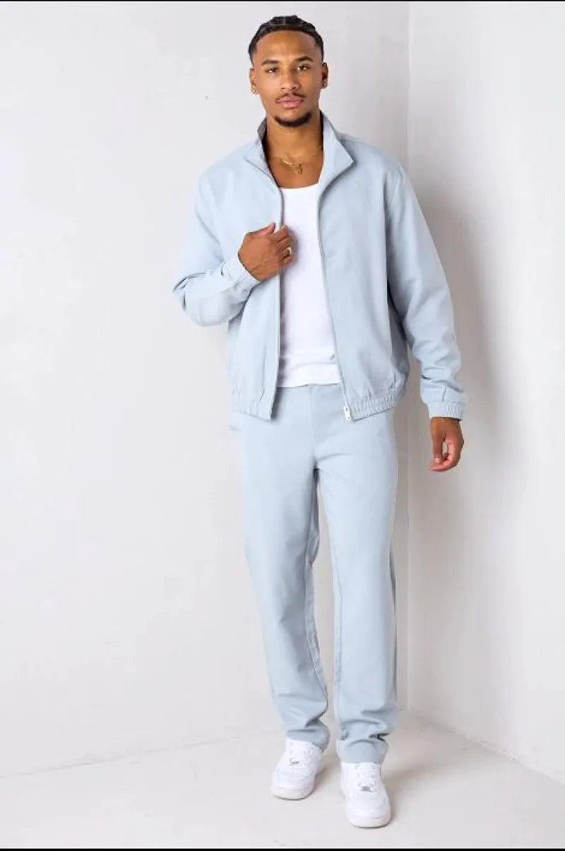 Two-piece ensemble: gray zip-up jacket + trousers