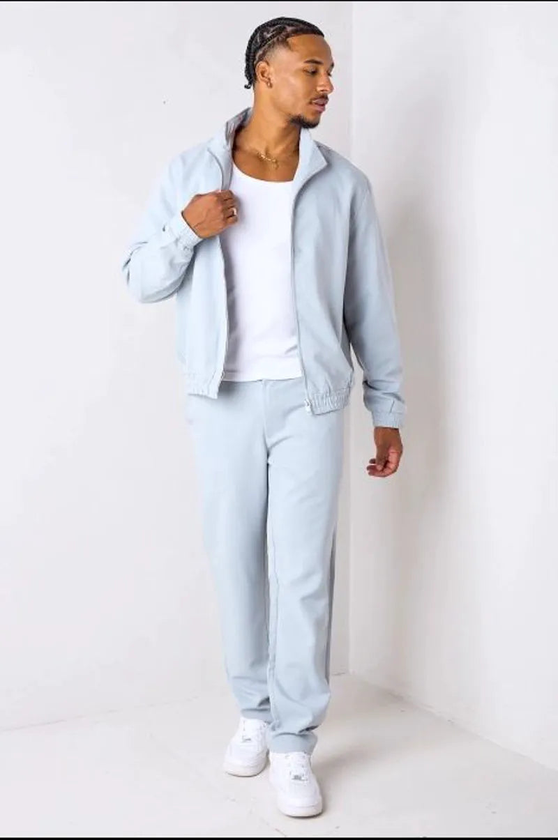 Two-piece ensemble: gray zip-up jacket + trousers