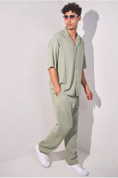 Two-piece ensemble in khaki with striped dual-texture shirt and trousers.