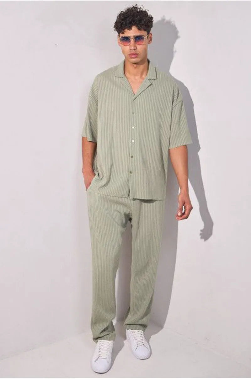 Two-piece ensemble in khaki with striped dual-texture shirt and trousers.