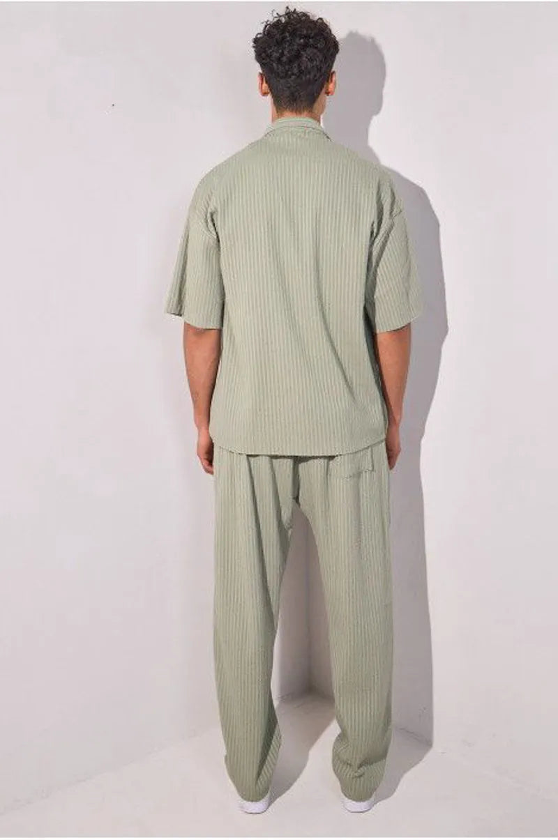 Two-piece ensemble in khaki with striped dual-texture shirt and trousers.