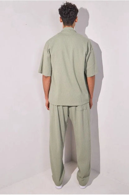 Two-piece ensemble in khaki with striped dual-texture shirt and trousers.