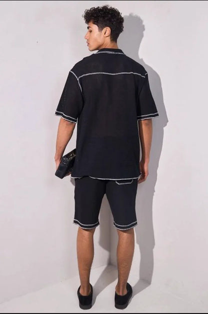Two-piece black ensemble with bi-color stitching: shirt + shorts
