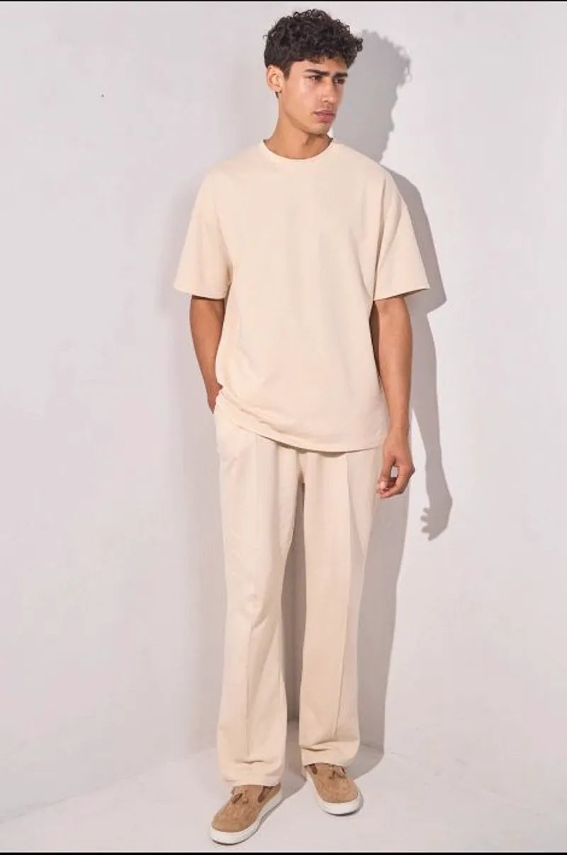Two-piece ensemble: beige t-shirt and trousers