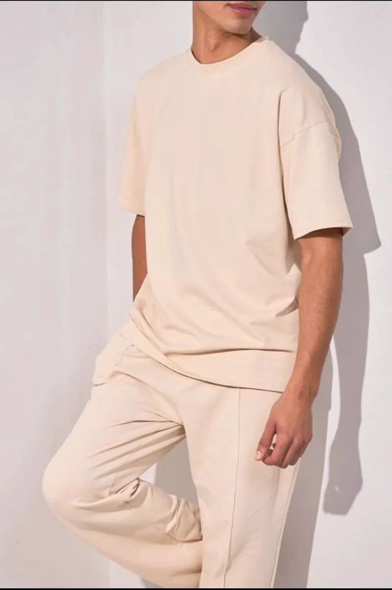 Two-piece ensemble: beige t-shirt and trousers