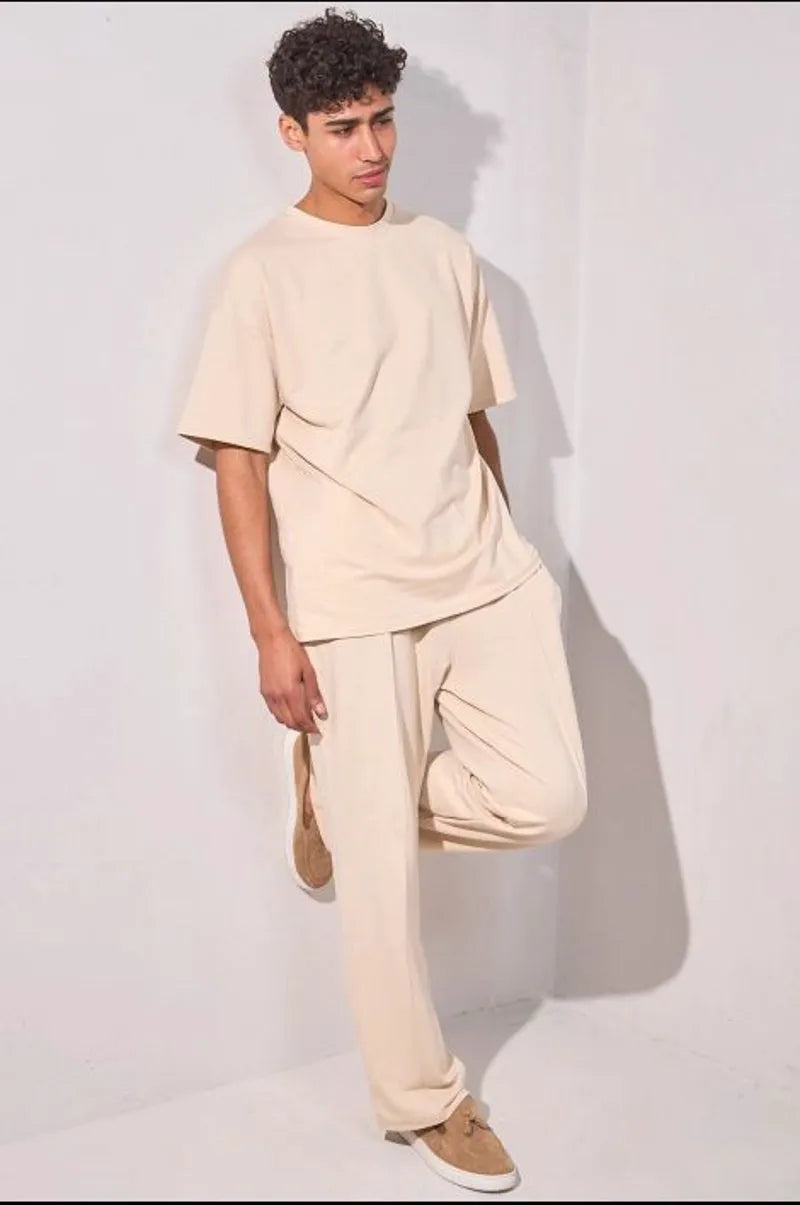 Two-piece ensemble: beige t-shirt and trousers