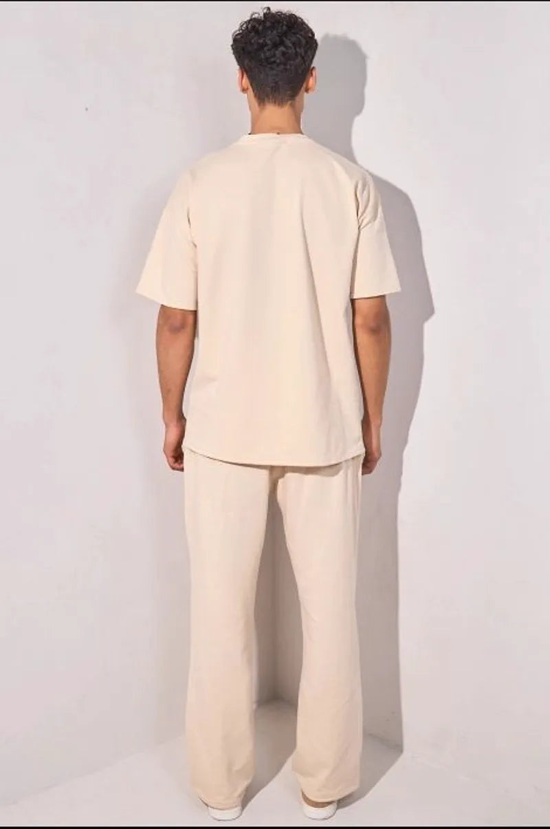 Two-piece ensemble: beige t-shirt and trousers
