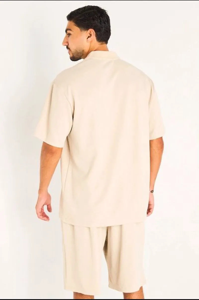 Ensemble deux pièces beige haut + short à motifs chevrons