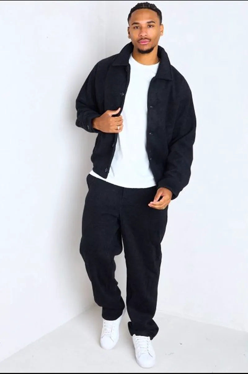 Black two-piece ensemble: jacket + trousers